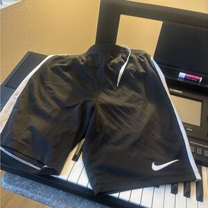 Nike Black and White Athletic Shorts with Swoosh Logo